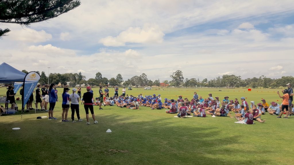 an image of a group of people discussing inside a disc golf park