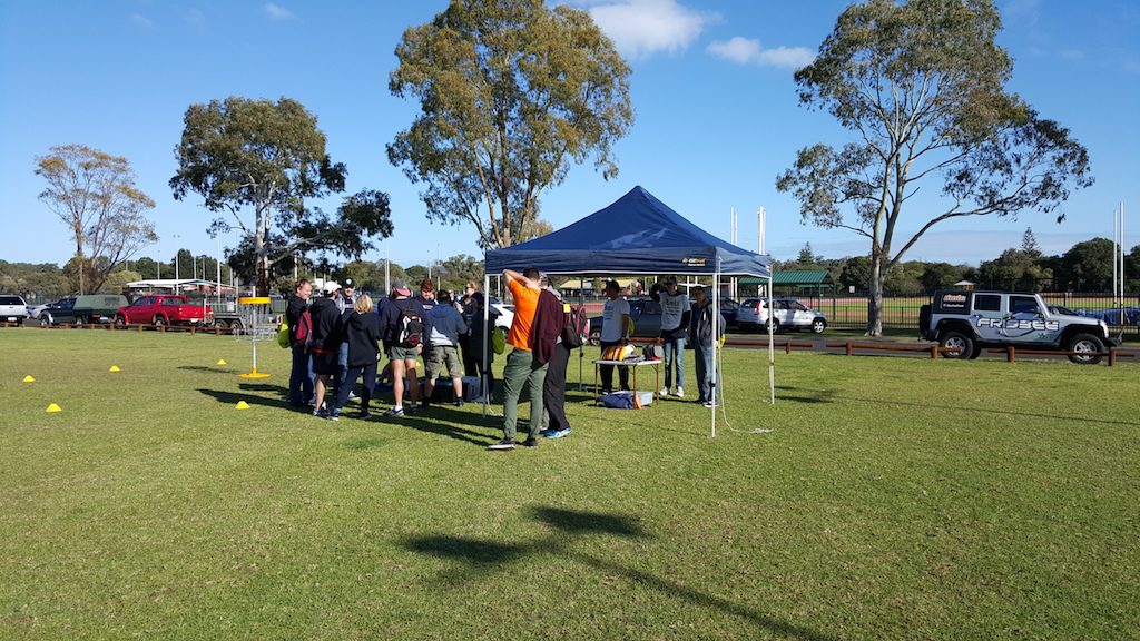 an image of group of people inside a disc golf park