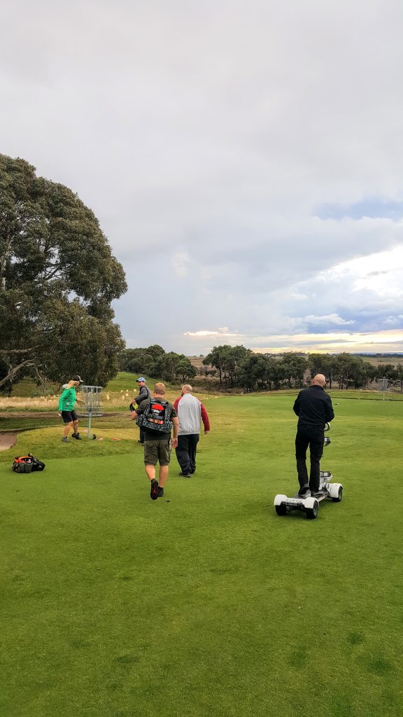 an image of men playing disc golf