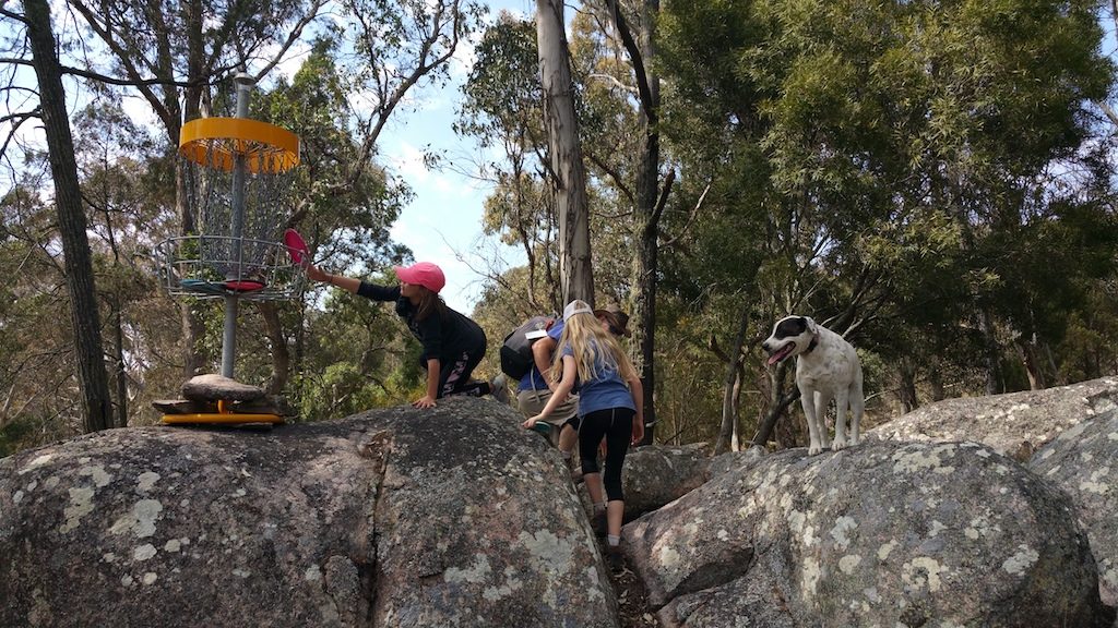 an image of family playing disc golf in a rocky mountain of Granite Mountain Disc Golf Course