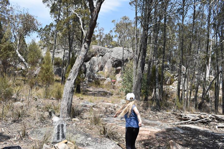 an image of a girl playing disc golf in Granite Mountain Disc golf course