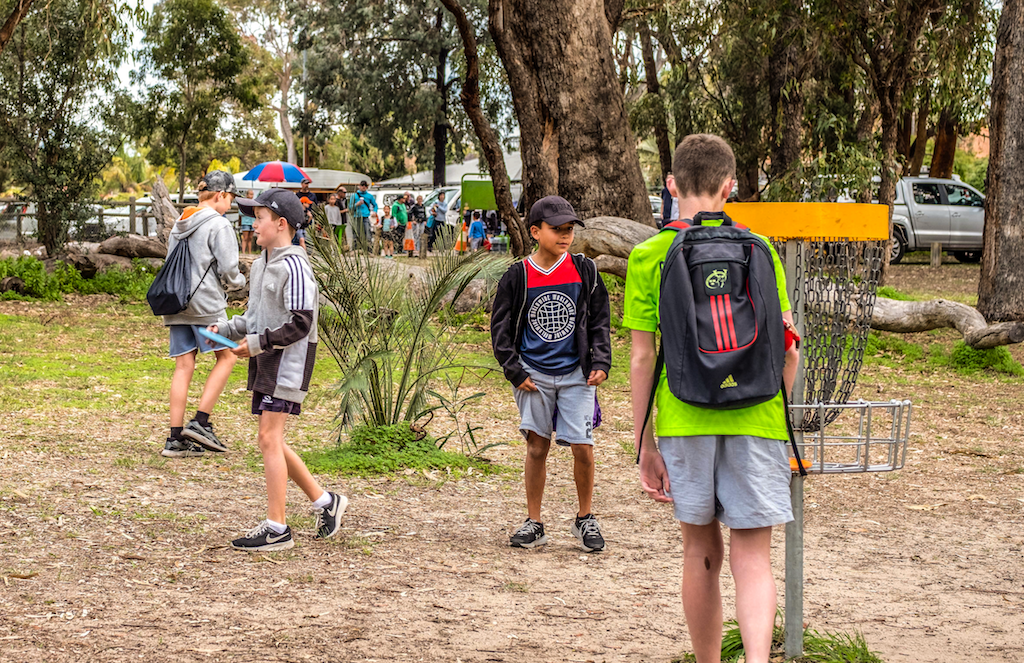 an image of people playing disc golf