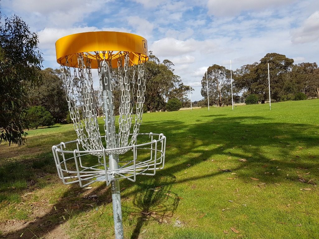 an image of a disc golf basket hole