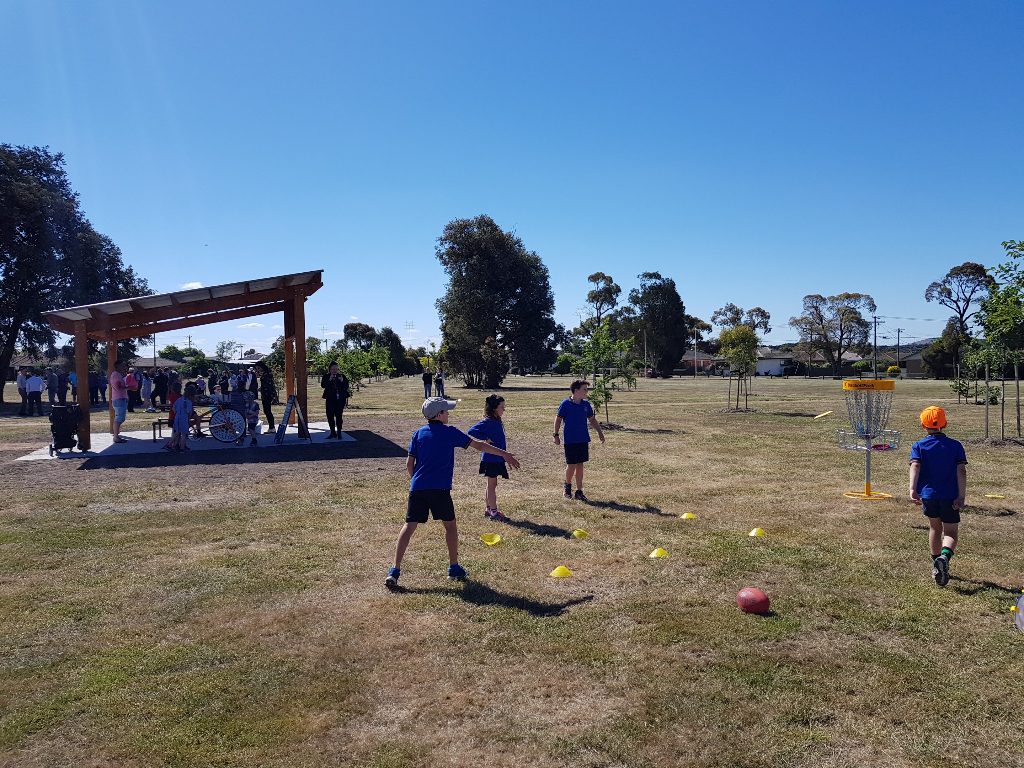 an image of kids playing disc golf