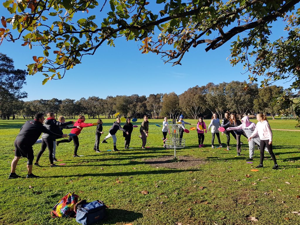 an image of group of people playing disc golf