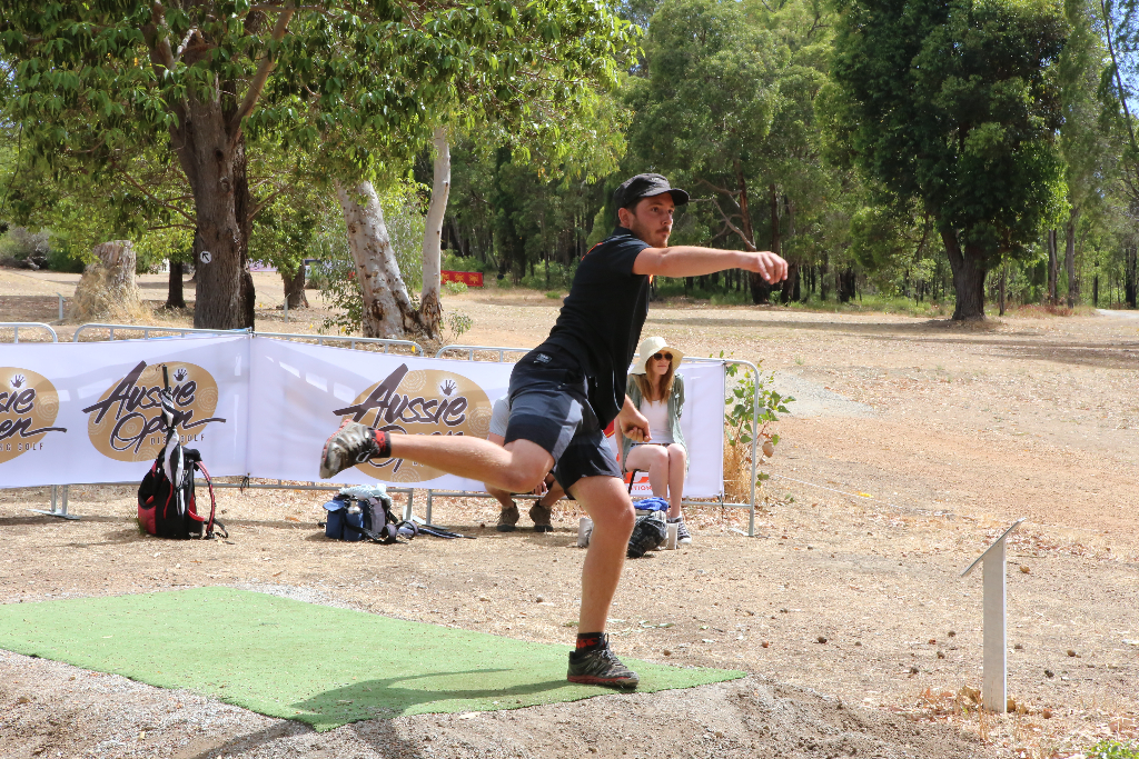 an image of a man playing disc golf in a tournament