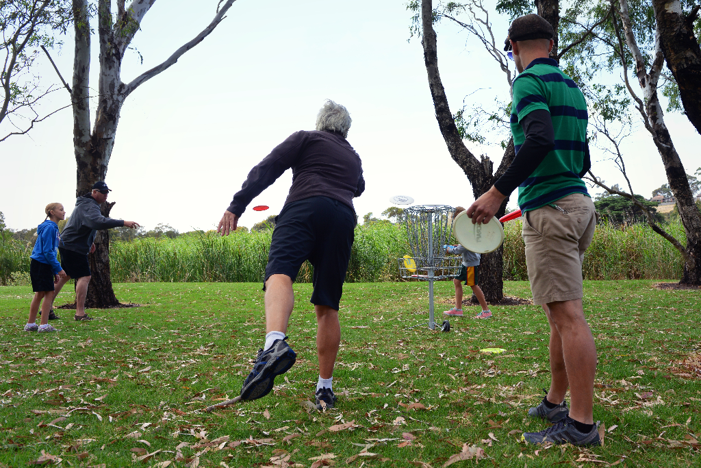 an image of group of people playing disc golf