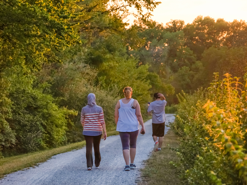 an image of women walking at disc golf park